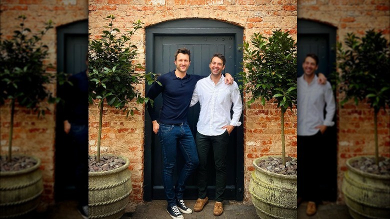 Dean Poulton and Borja De Maqua standing in front of outside door