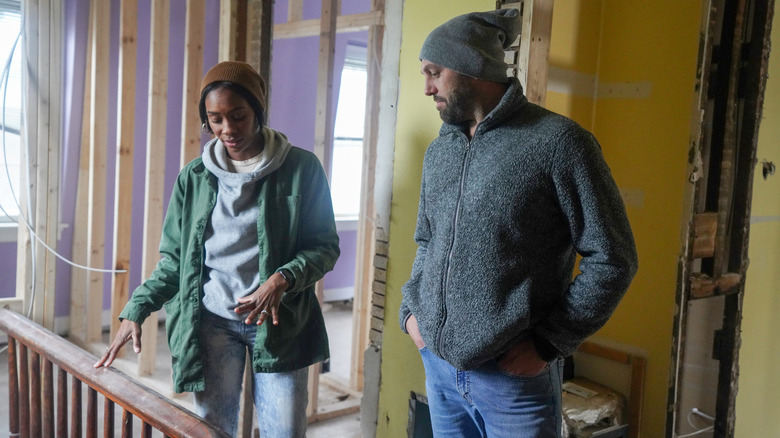 Denese and Mike Butler examining renovation room