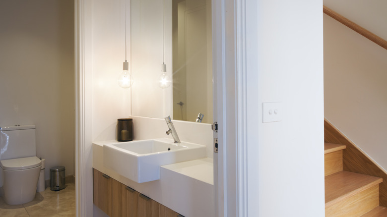 white powder room near staircase