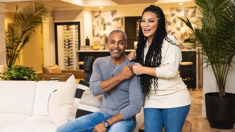 Egypt Sherrod and Mike Jackson smiling and fist-bumping