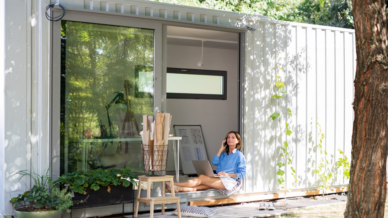 Woman in backyard office