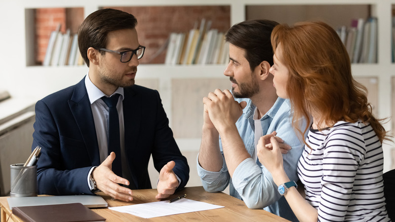 Couple speaking with lender