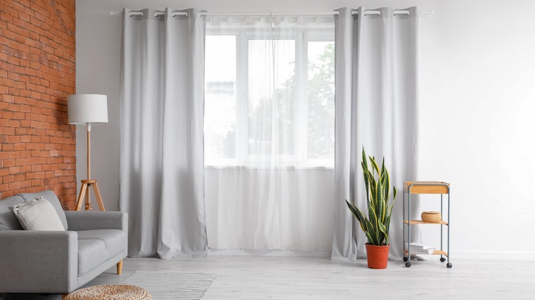 Gray curtains hanging in window