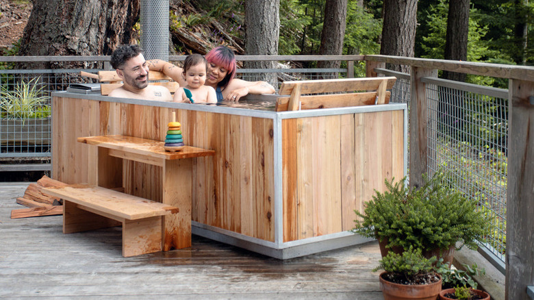 Family enjoying wood-burning hot tub