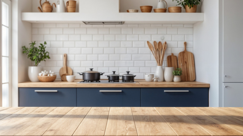 Blue and white kitchen with wood countertop