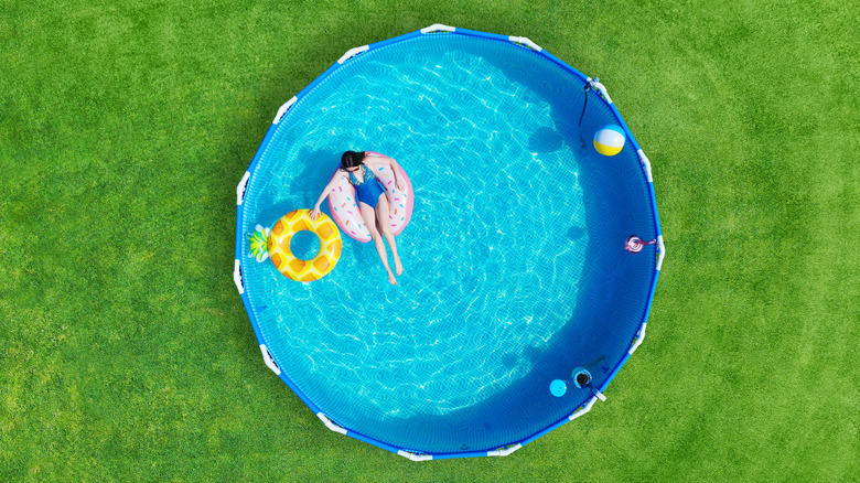 woman in above ground pool