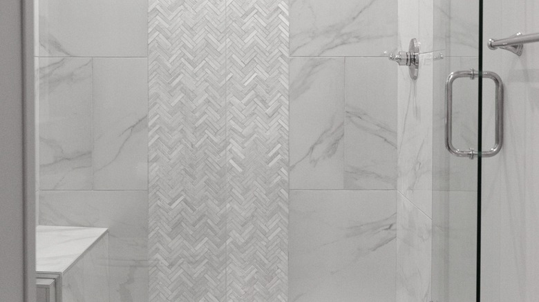 Marble and tile shower wall