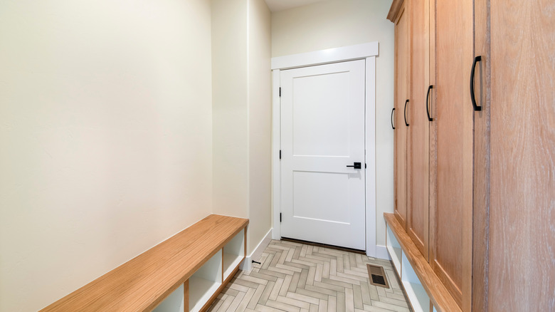 wooden storage cabinets in mudroom