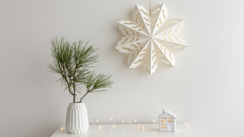 Paper snowflake and pine needles