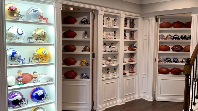 Shelves filled with sports memorabilia