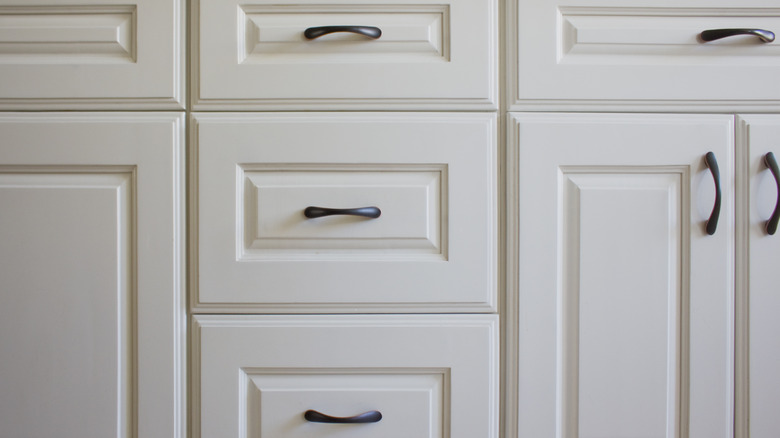 White drawers with black pulls