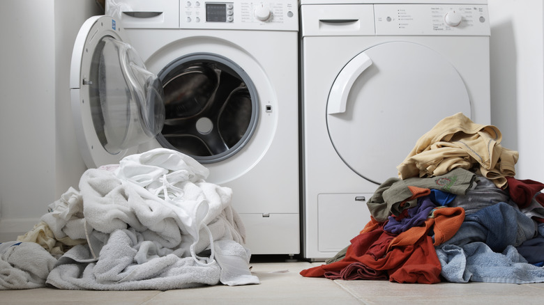 Piles of light and dark laundry 