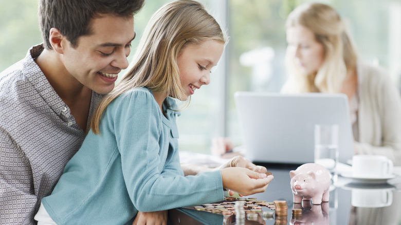 Man and child counting coins