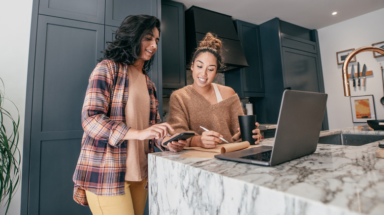 Two women looking at computer