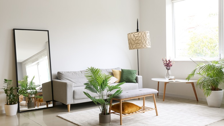 Living room with natural light and floor lamp