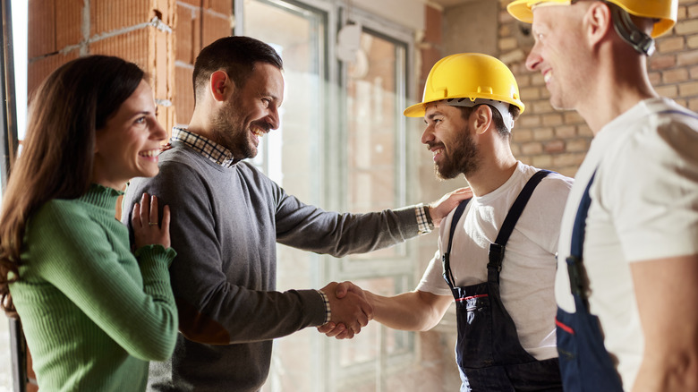 Contractor shaking hands with homeowner