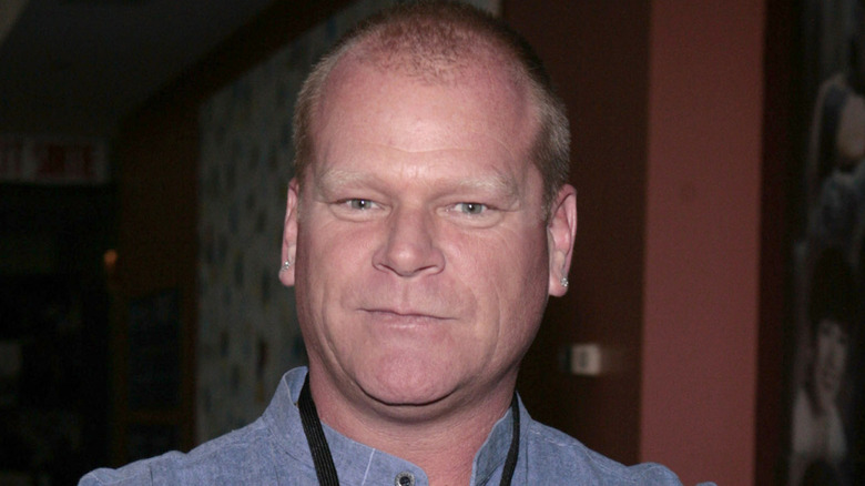 Mike Holmes posing at an event