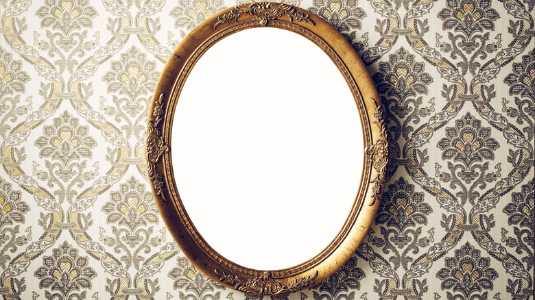 vintage mirror on wallpaper