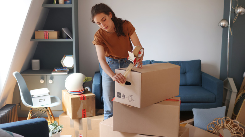 Woman packing boxes to move house