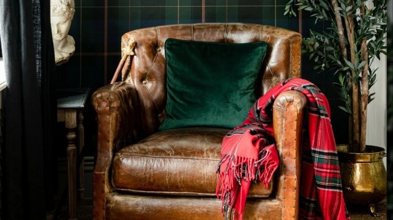 Plaid wallpaper and leather chair