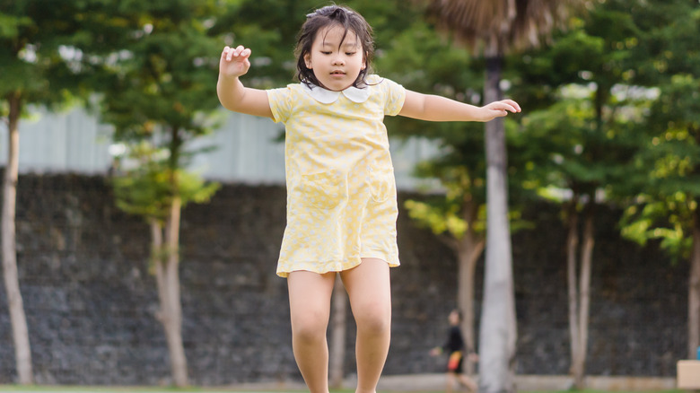 little girl on trampoline 