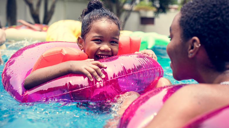 family in a swimming pool 