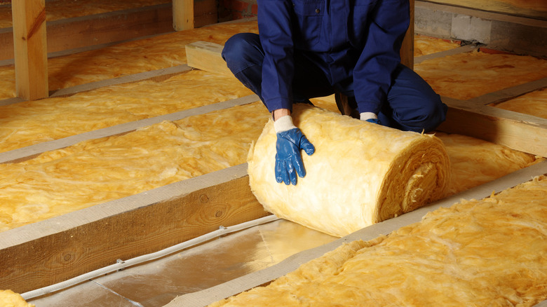 rolling out insulation in attic 