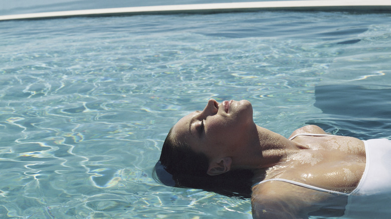 Woman relaxing in saltwater pool