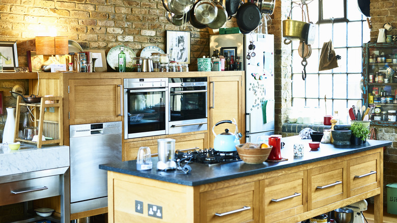 Busy kitchen with wood island