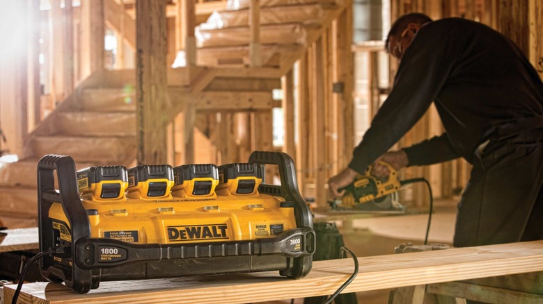 Man running a power tool from portable charger power station