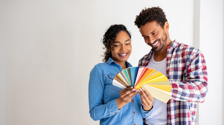 Couple looking at color swatches