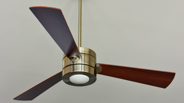 Three-blade fan on ceiling 