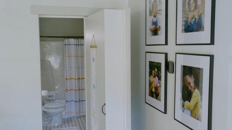 Hidden bathroom through bookcase door.