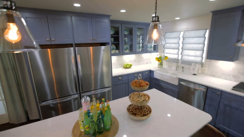 Blue cabinets in a modern kitchen.