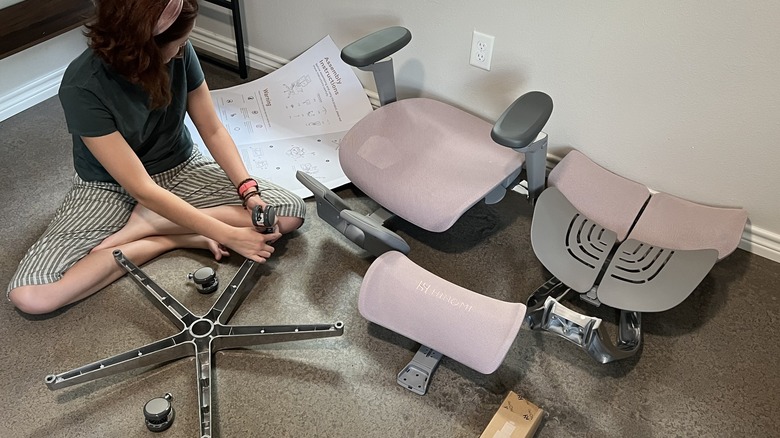 Person putting together desk chair