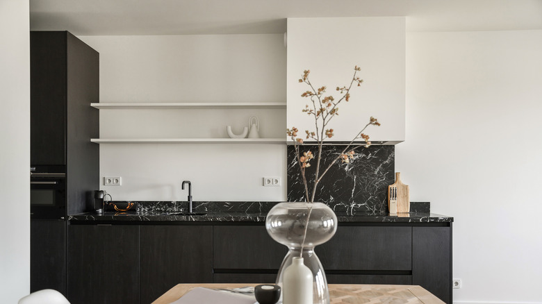 Black kitchen countertops black backsplash 