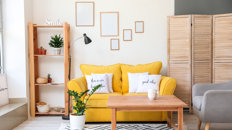 Yellow couch in a cozy natural living room 