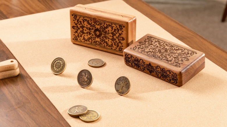 Engraved coins and wooden boxes