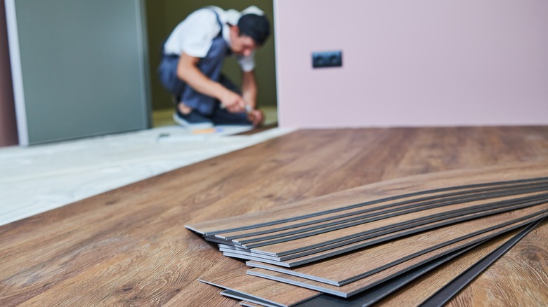 Person installing laminate floor