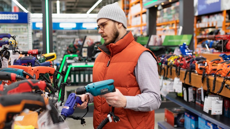 Man shopping for power tools