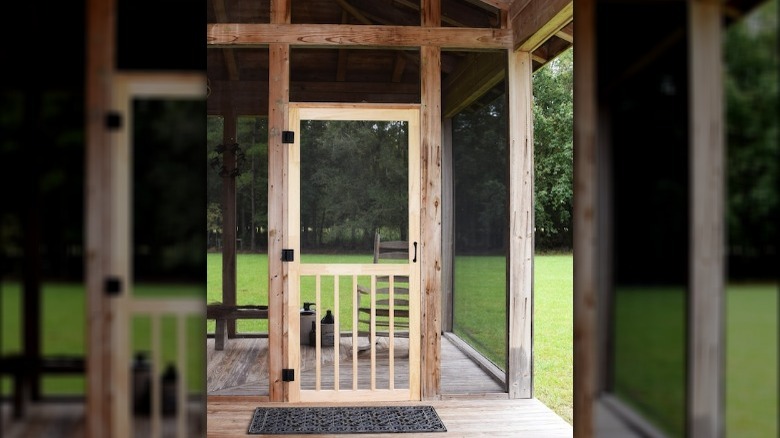 Rustic wood hinged screen door