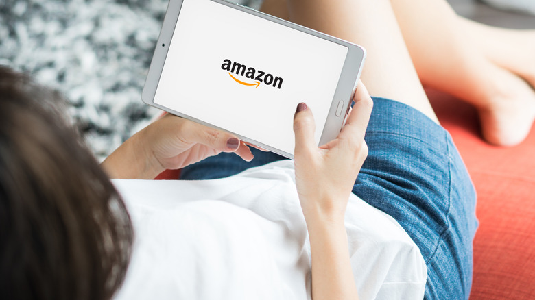 Woman viewing Amazon on tablet