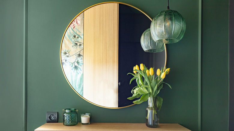 Round mirror on wall