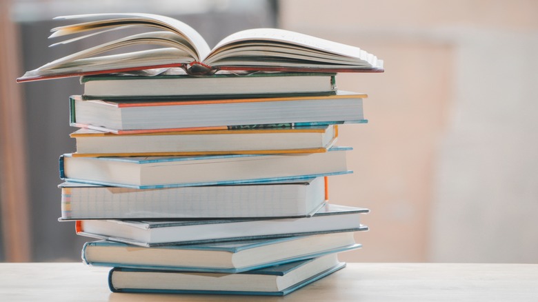 a stack of books on a desk