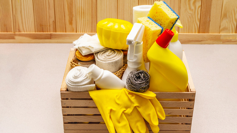 cleaning kit in wooden basket