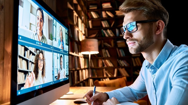 Man in front of computer screens 