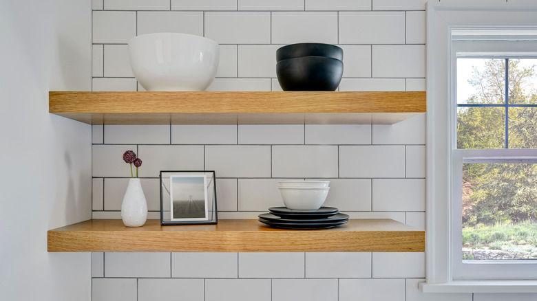 Ceiling-height kitchen backsplash with floating shelves