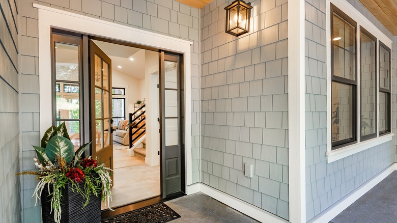 Front entry door of a modern home showing black front door