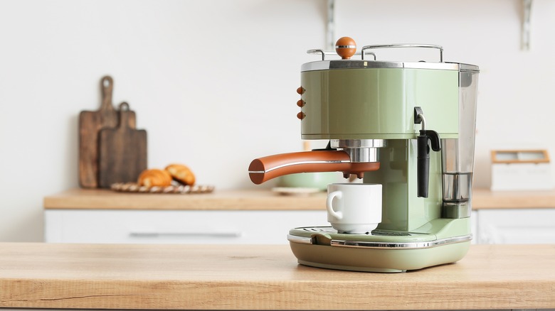 Green coffee maker in kitchen
