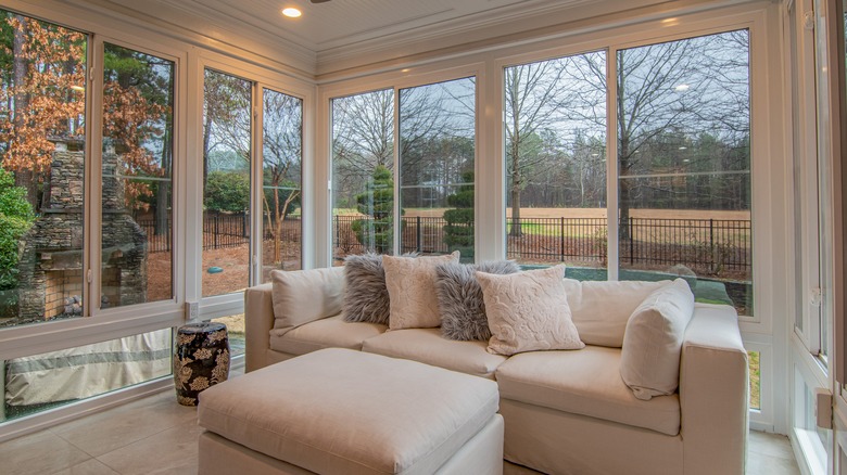 White couch and large windows